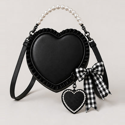 Black heart purse with imitation pearl top handle, ruffled edge, gingham bow and pearl bordered heart charm