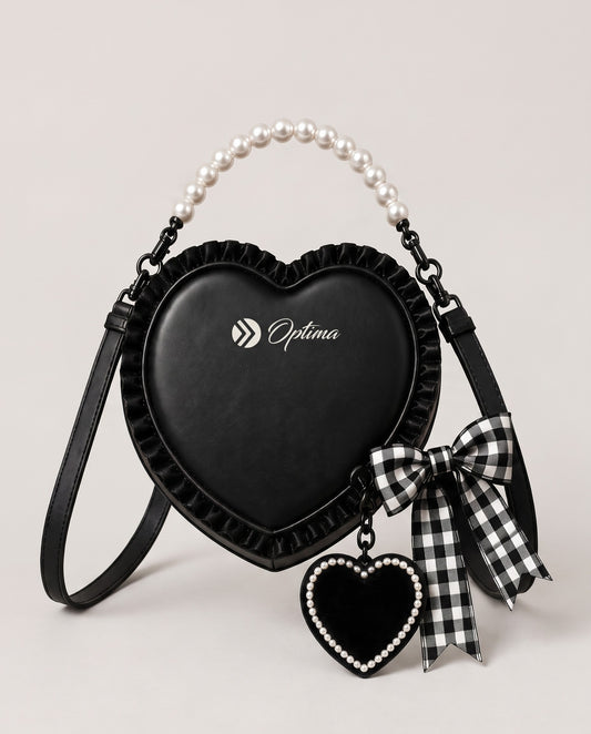 Optima black heart bag with ivory pearl top handle, ruffled edge, gingham bow and pearl-bordered heart charm, front view